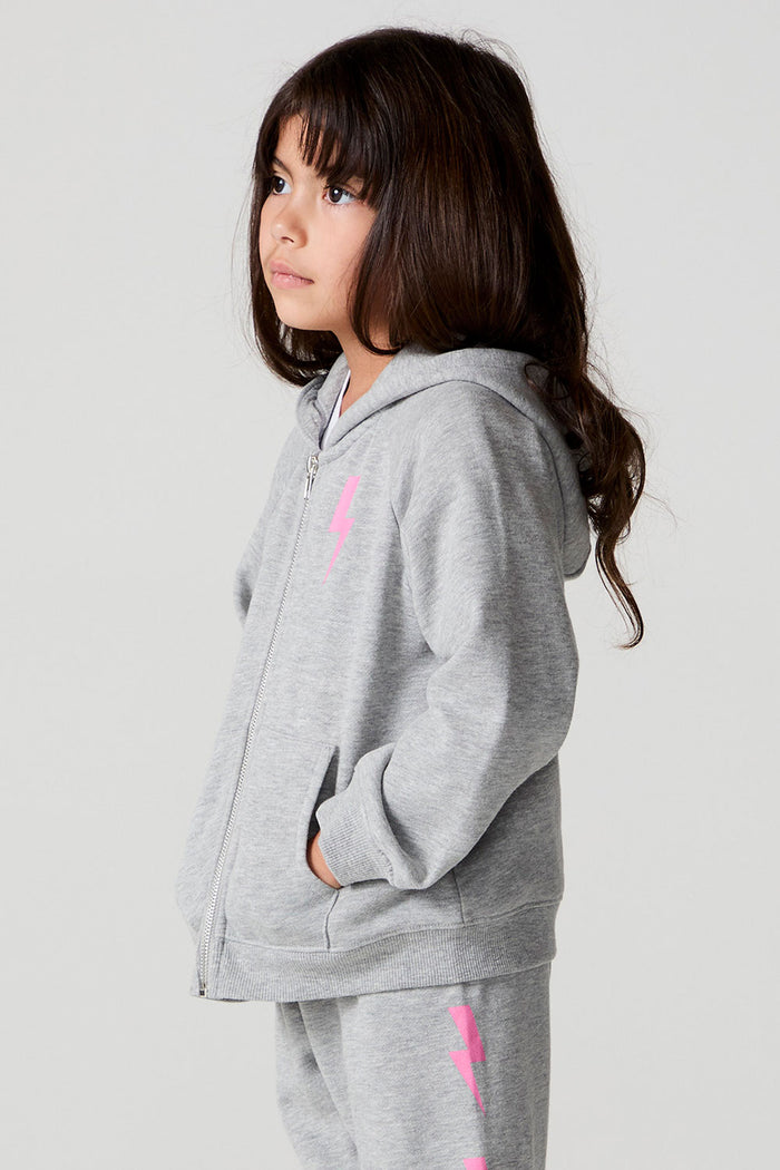 Side view of a girl wearing the Chaser  Bolting Bolt Long Sleeve on a neutral background