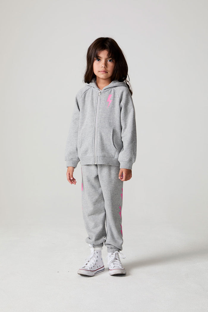 Full body front view of a girl wearing the Chaser  Bolting Bolt Long Sleeve on a neutral background