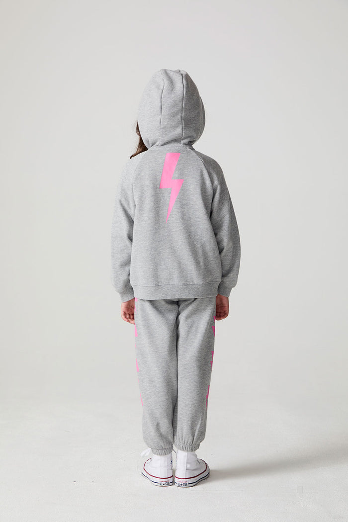 Full body back view of a girl wearing the Chaser  Bolting Bolt Long Sleeve on a neutral background