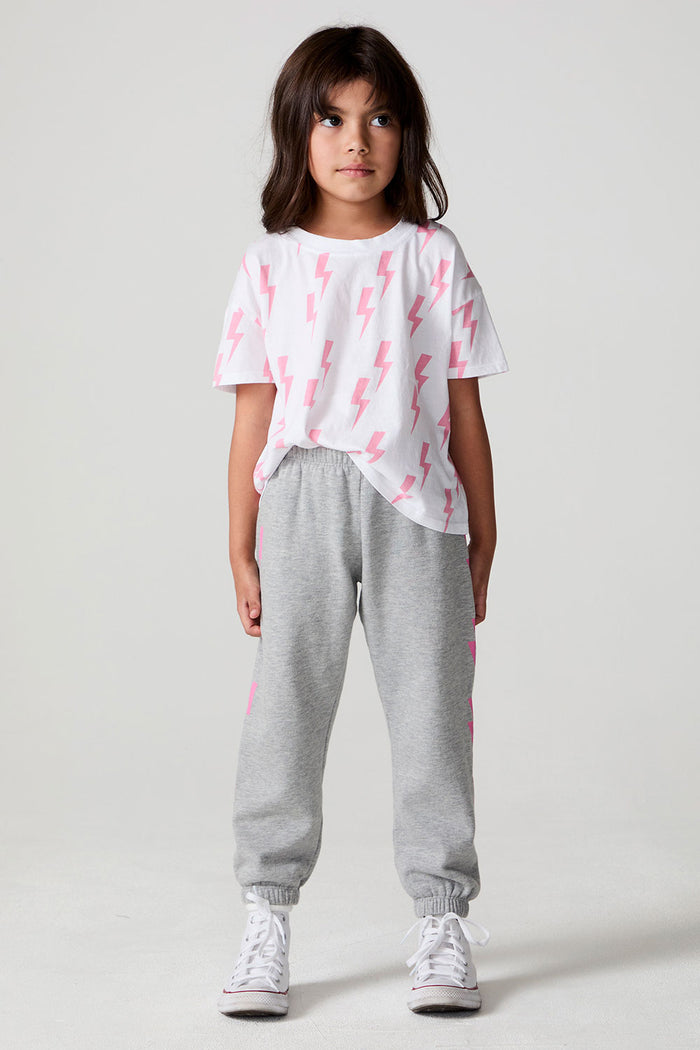 Full body front view of a girl wearing the Chaser  Bolting Bolt Pant on a neutral background