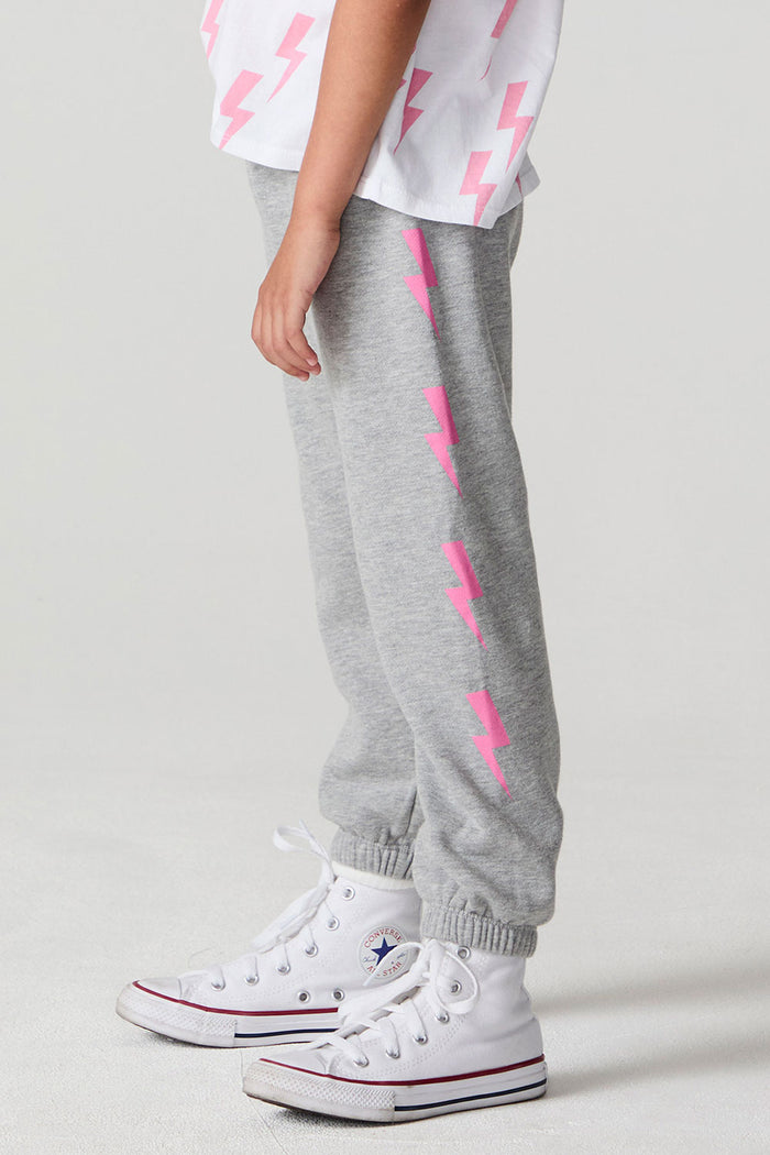 Side view of a girl wearing the Chaser  Bolting Bolt Pant on a neutral background