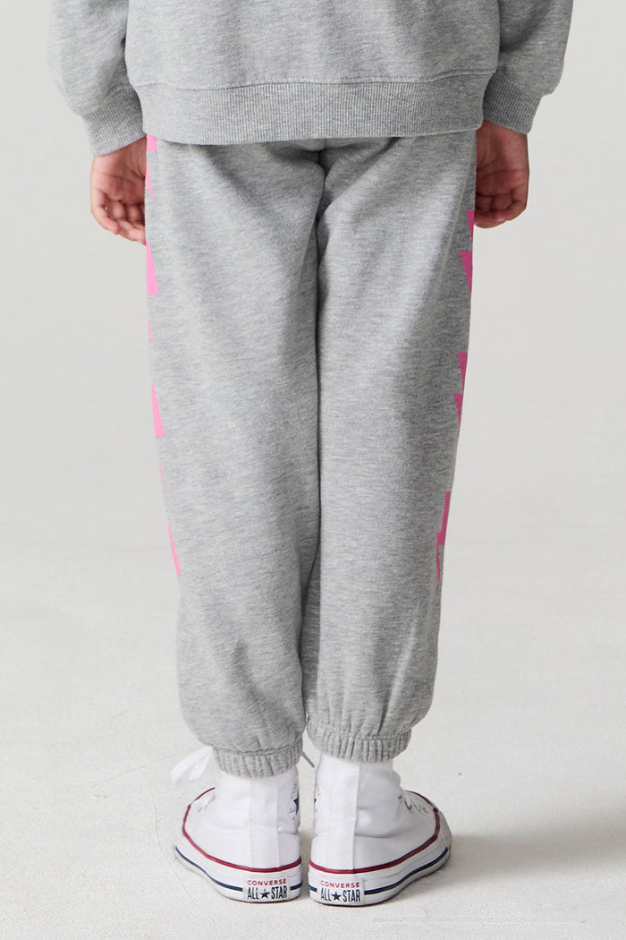 Back view of a girl wearing the Chaser  Bolting Bolt Pant on a neutral background