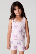 Front view of a girl wearing the Chaser Check Bow Tank and shorts on a neutral background