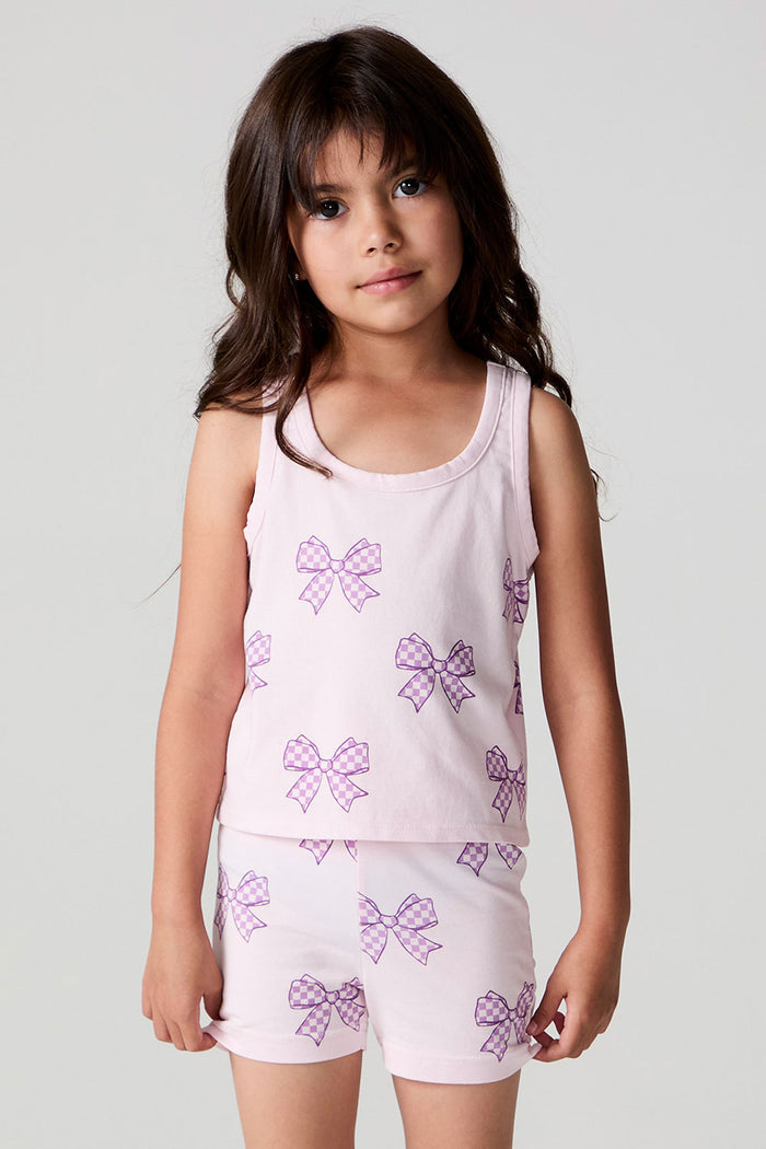 Front view of a girl wearing the Chaser Check Bow Tank and shorts on a neutral background
