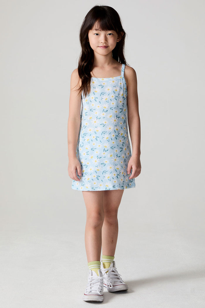Front view of a girl wearing the Chaser Ditsy Daisies Dress on a neutral background