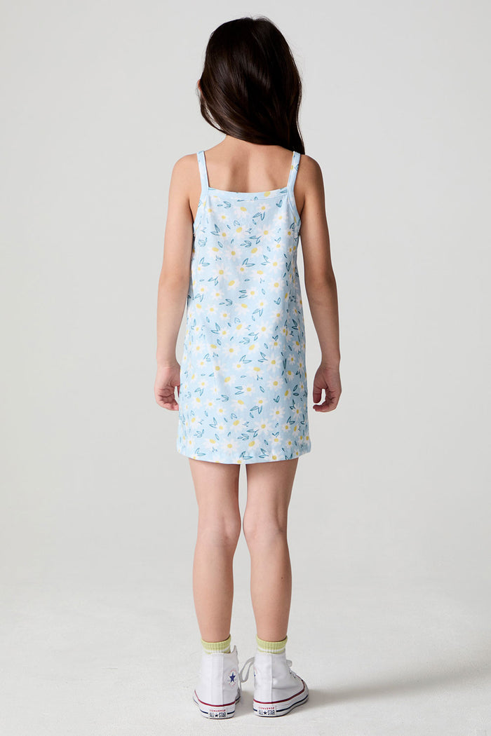 Back view of a girl wearing the Chaser Ditsy Daisies Dress on a neutral background