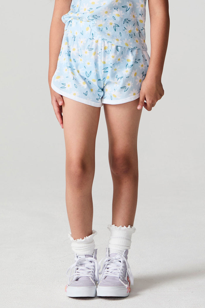 Front view of a girl wearing the Chaser Ditsy Daisies Shorts on a neutral background with arms at her sides