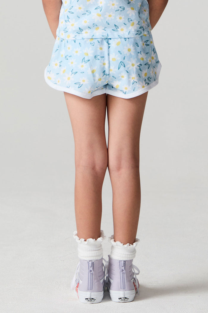 Back view of a girl wearing the Chaser Ditsy Daisies Shorts on a neutral background with matching tank