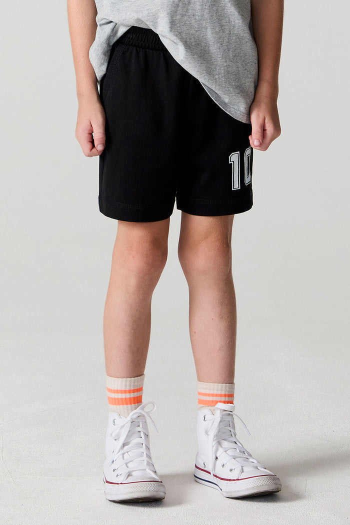 Front view of a boy wearing the Chaser Go Team Shorts on a neutral background