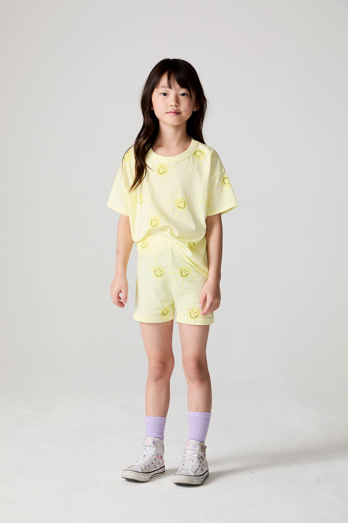 Front view of a girl wearing the Chaser Happy Happy Shorts and matching Happy Happy shorts on a neutral background