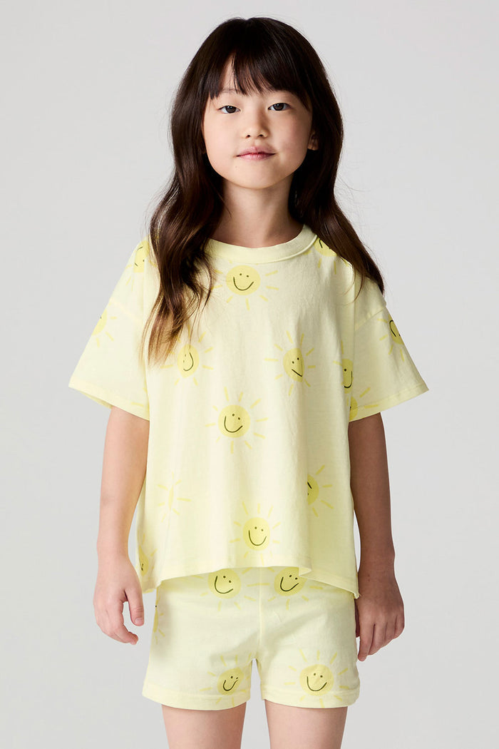 Front view of a girl wearing the Chaser Happy Happy Tee and matching Happy Happy Shorts on a neutral background