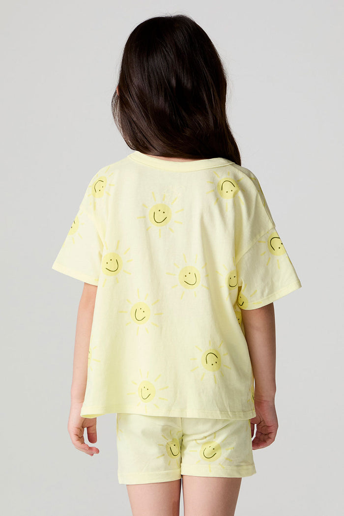 Back view of a girl wearing the Chaser Happy Happy Tee on a neutral background with hair over one shoulder