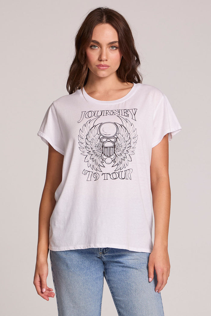 Front view of a woman wearing the Chaser Journey 79 Tour Tee on a neutral background