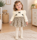 Luxe Leopard Babyjurkje met Zwarte Strikjes