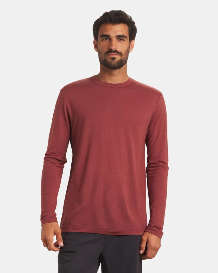 Front view of Men’s Aire long-sleeve alpaca shirt in clay on model showing crew neck and regular fit with light gray background