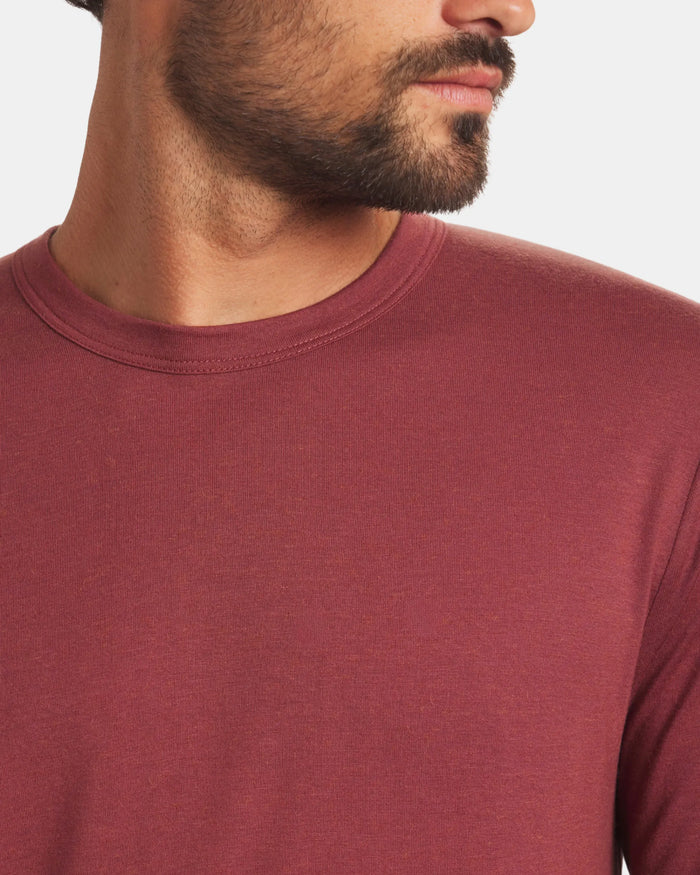 Close up front of Men’s Aire long sleeve alpaca shirt in clay showing crew neckline and slim fit on model