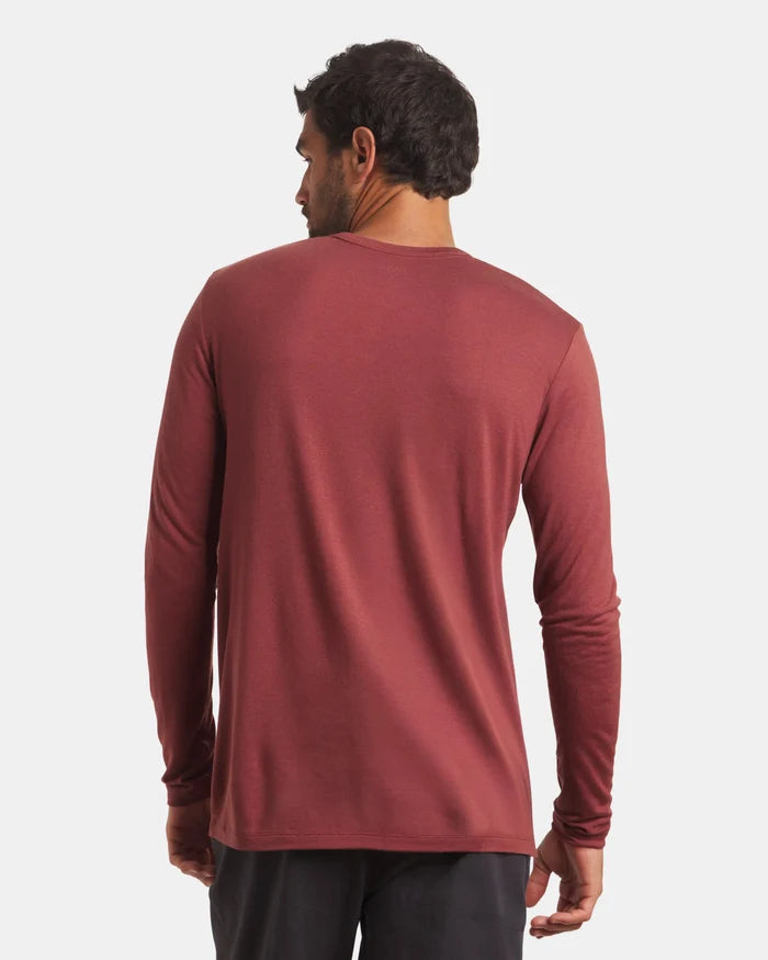 Rear view of Men’s Aire Long Sleeve in clay showing long sleeves and regular fit in soft, lightweight alpaca fabric