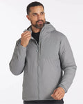 Three-quarter front of Men’s Apu Lightweight Puffer in storm gray showing hood, chest zip pocket, and front zipper on white background