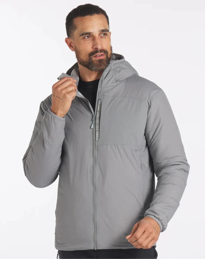 Three-quarter front of Men’s Apu Lightweight Puffer in storm gray showing hood, chest zip pocket, and front zipper on white background
