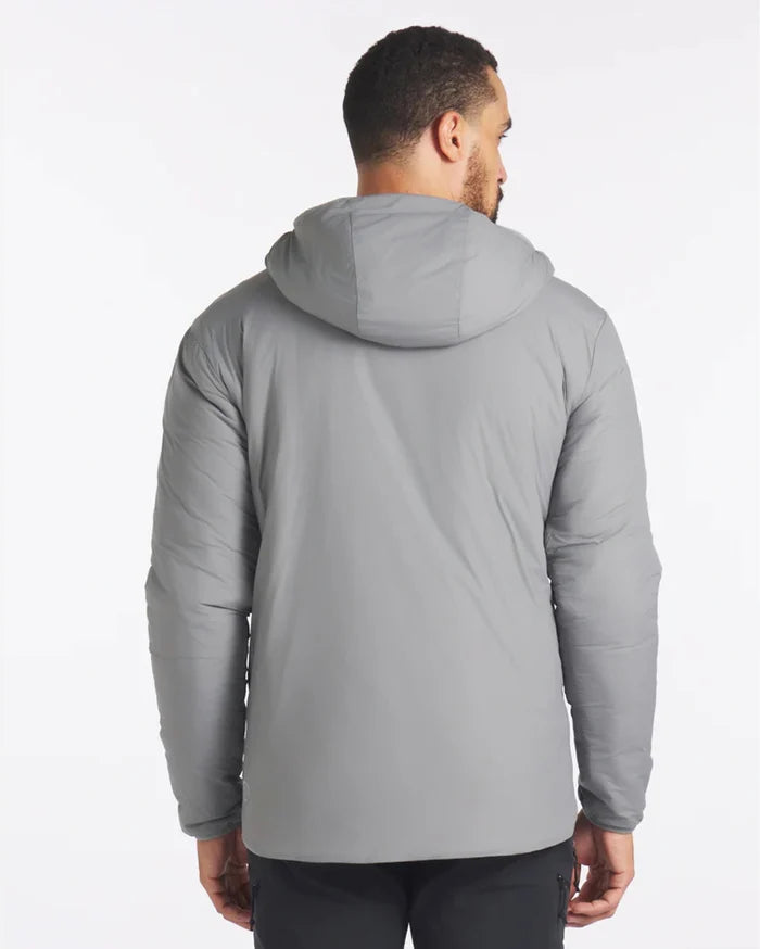 Rear view of Men’s Apu puffer jacket in Storm showing hood and quilted fill on model against white background