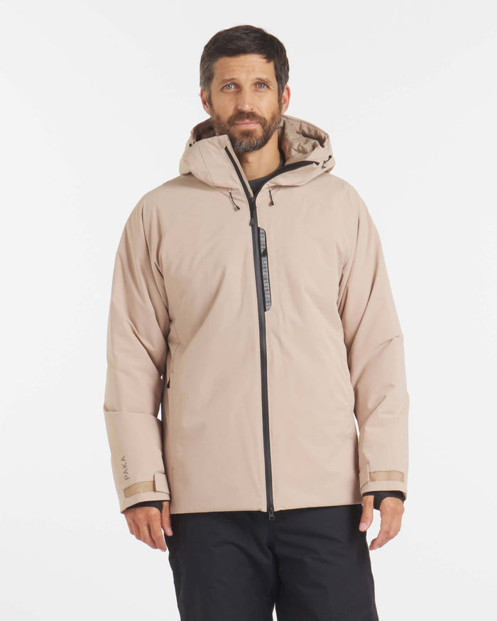 Front view of Men’s Apu Parka in desert tan, hooded jacket with black center zipper and adjustable cuffs on white background