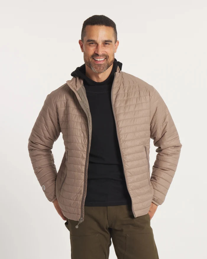 Model Smiling with Hands on Waist in Sustainable Men's Mayu Ultralight Jacket in Fossil / Tan – PAKA Apparel