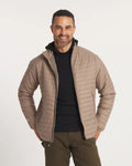 Model Smiling with Hands on Waist in Sustainable Men's Mayu Ultralight Jacket in Fossil / Tan – PAKA Apparel