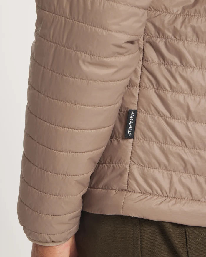 Close-up back view of Men’s Mayu Ultralight Jacket in fossil tan showing horizontal quilted baffles and PAKAFILL tag on hem