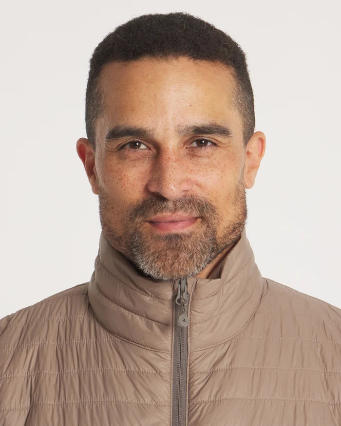 Front close-up of Men’s Mayu Ultralight Vest showing quilted alpaca-insulated puffer and high zip collar on a light background