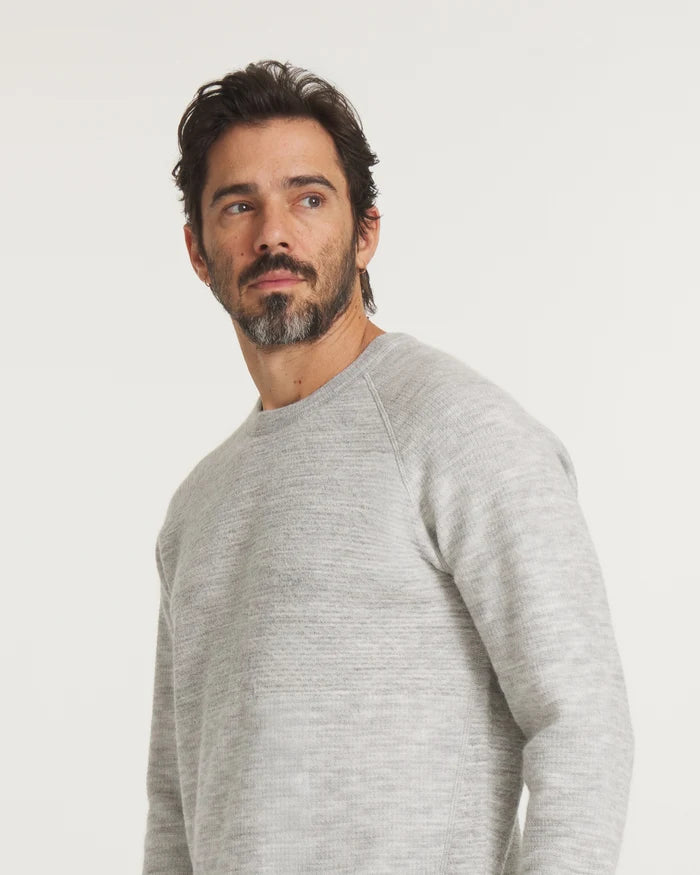 Model Wearing Men’s Mountain Crew Alpaca Outdoor Sweater in Heather Light Grey – PAKA Apparel