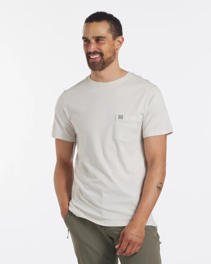 Three-quarter front view of Men’s Pocket Tee in bone, alpaca blend, chest pocket with Inca tag on white background