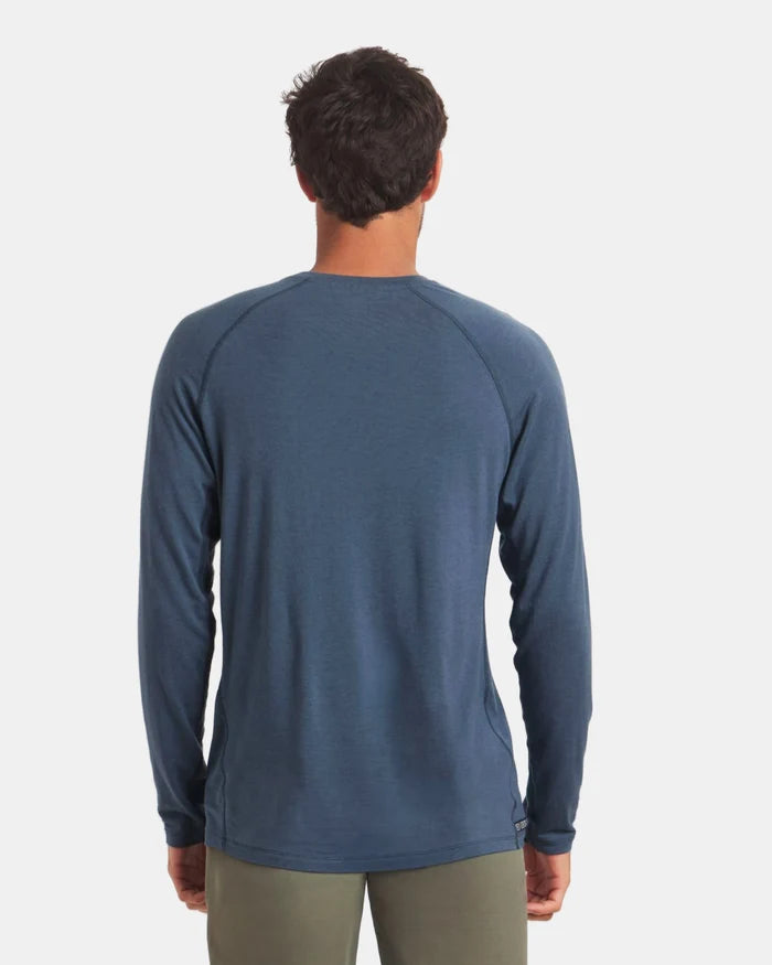 Rear view of Men’s Sol Crew long-sleeve navy alpaca sun shirt showing raglan sleeves and regular fit on light gray background