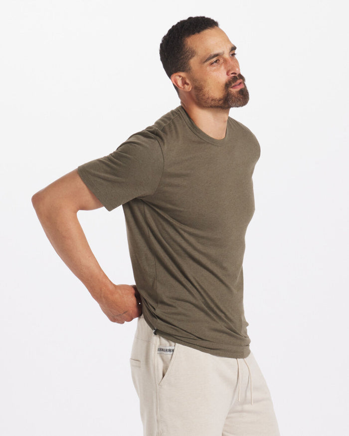 Model is 6'3" and wearing size Large. Side Shot of Model Wearing Andean Moss / Dark Green Men's Natural Alpaca T-Shirt – PAKA Apparel