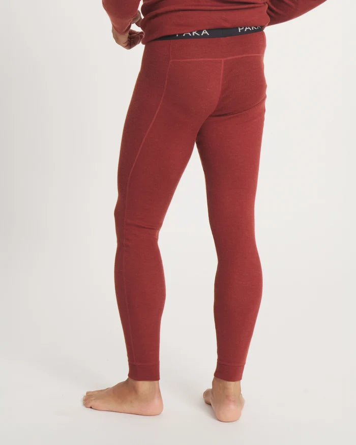 Rear View of Alpaca-Merino Wool Thermal Baselayer Pants in Clay Red on Model – PAKA Apparel