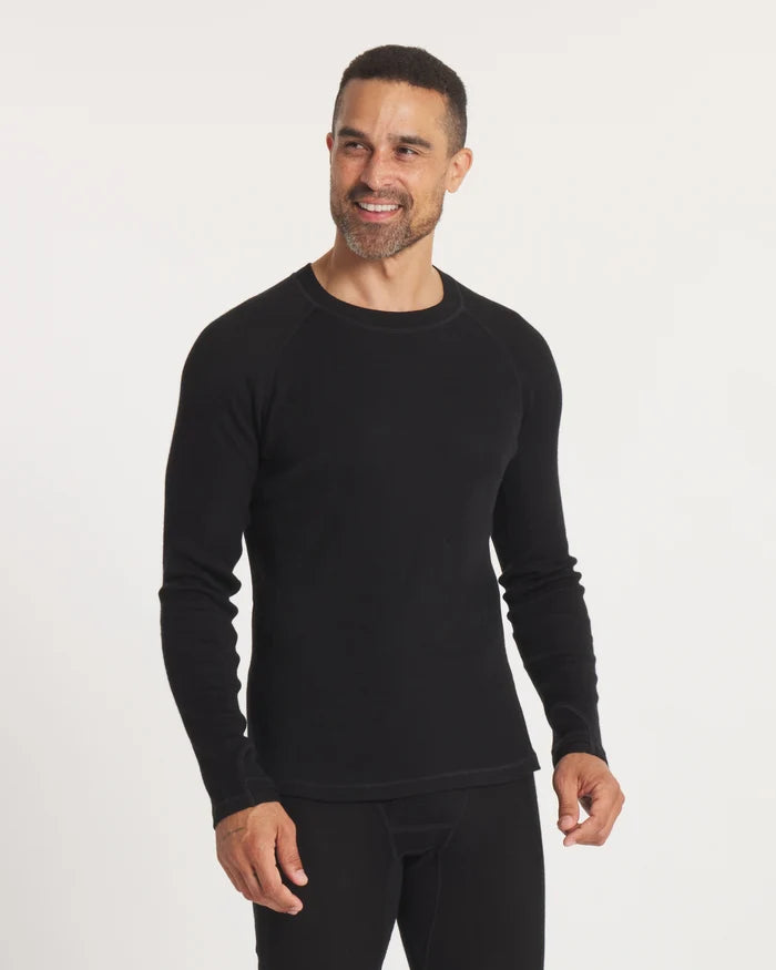 Front three-quarter view of men’s black alpaca thermal crew baselayer, slim fit with raglan sleeves on white background