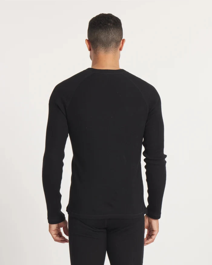 Back view of Men’s Thermal Crew alpaca baselayer showing raglan sleeves and slim, hip-length fit on model against a light studio background