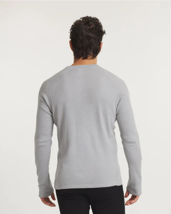 Rear view of Men’s Thermal Crew alpaca baselayer showing raglan sleeves and slim fit on model with off-white background