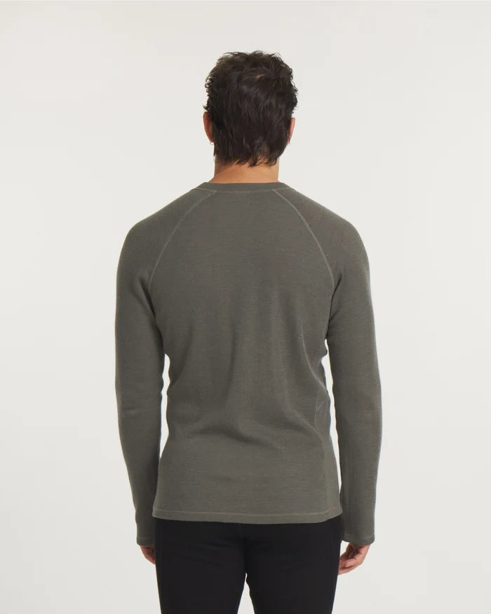 Back view of Men’s Thermal Crew alpaca baselayer on model showing raglan shoulder seams and thermal knit in Andean Moss on white background
