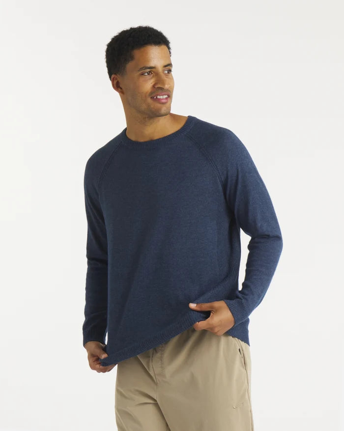 Angled front of Men’s Ultralight 1.0 Crew in navy on model, lightweight alpaca COOLMAX knit, raglan sleeves, white background