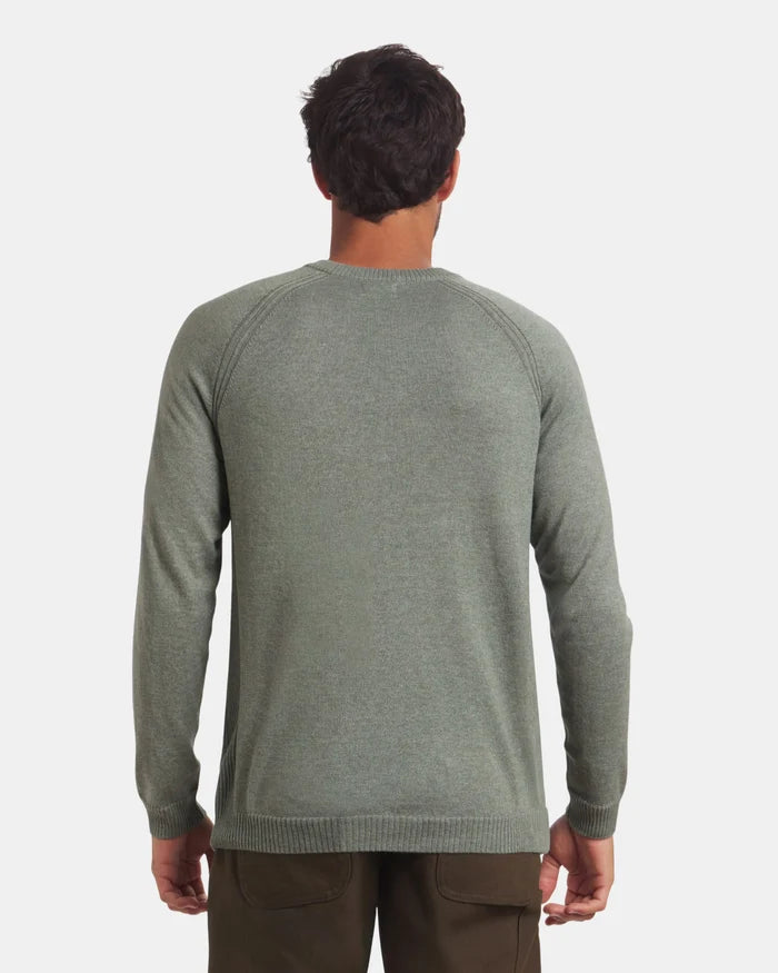 Back view of Men’s Ultralight Crew in lichen on model showing raglan sleeves and ribbed cuffs against light gray background