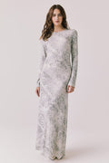 Full body view of woman wearing Chaser’s light Opal Python Print Maxi Dress with long sleeves, a subtle snakeskin design and relaxed fit against a white background