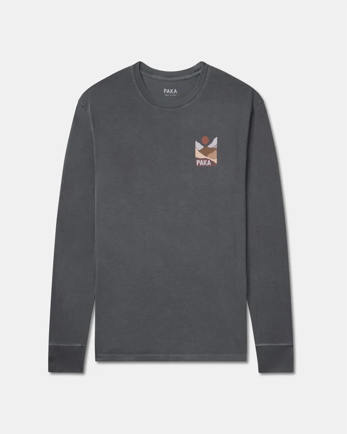 Front view of PAKA Sunset long sleeve T-shirt showcasing small left-chest sunset graphic and pigment-dyed charcoal background