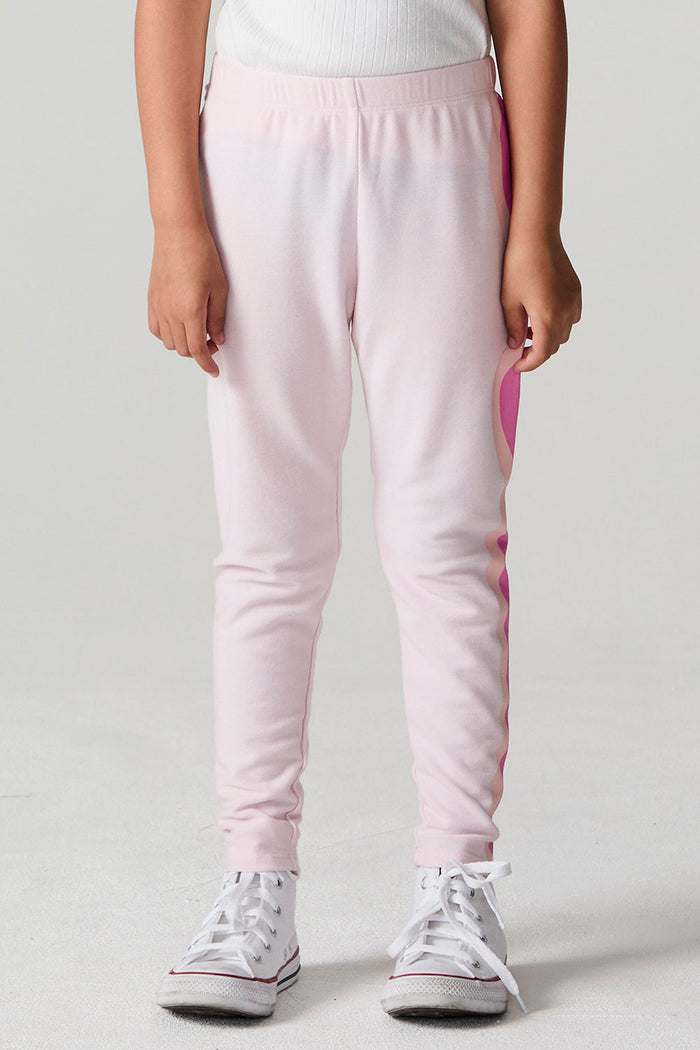 Front view of a girl wearing the Chaser Slim Begonia Leggings on a neutral background
