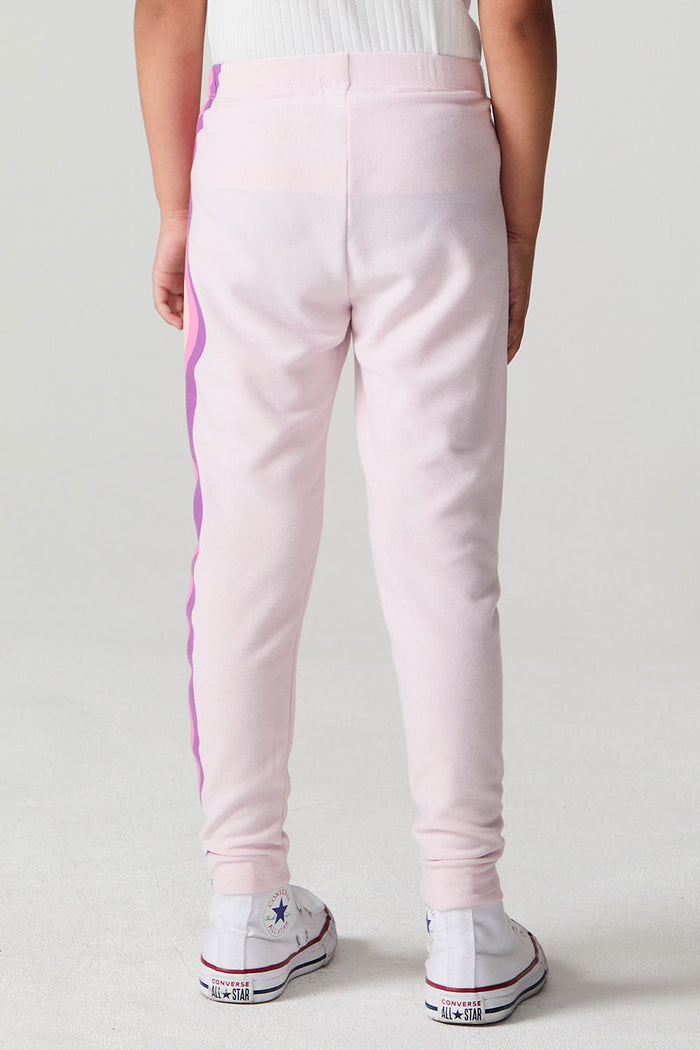 Back view of a girl wearing the Chaser Slim Begonia Leggings on a neutral background
