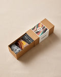Box of socks with a colorful label on a beige background
