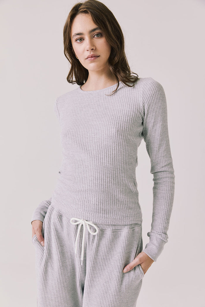 Front view of woman wearing Chaser’s Spritz Long Sleeve on a white background