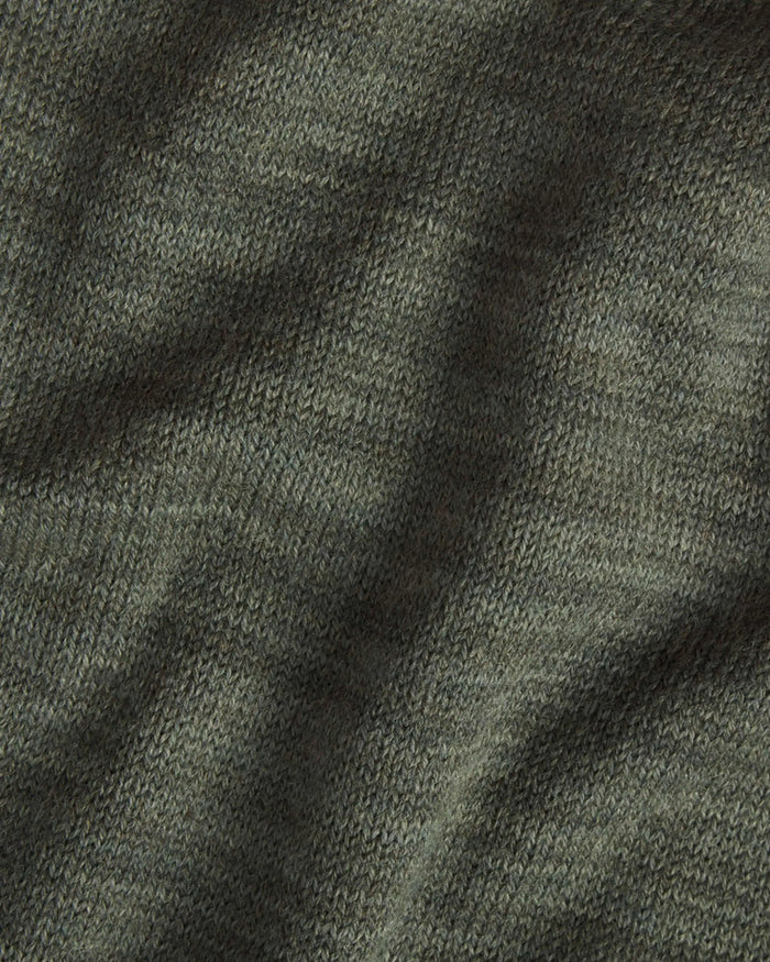 Close-up of The Hoodie alpaca hoodie showcasing eucalyptus green knit texture and soft drape