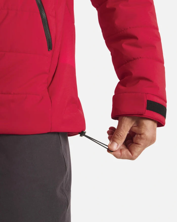 Close-up of The Huascarán Jacket showing red recycled nylon hem and sleeve with adjustable drawcord and Velcro cuff on white background
