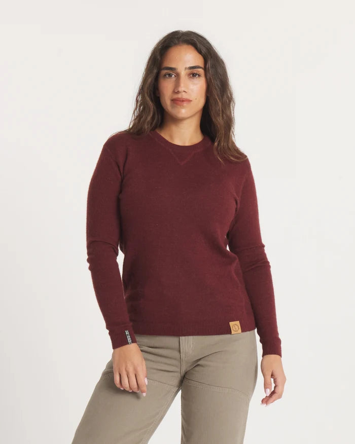 Front view of The Lightweight Crew alpaca crewneck in burgundy showing V stitch neckline and leather logo patch on white