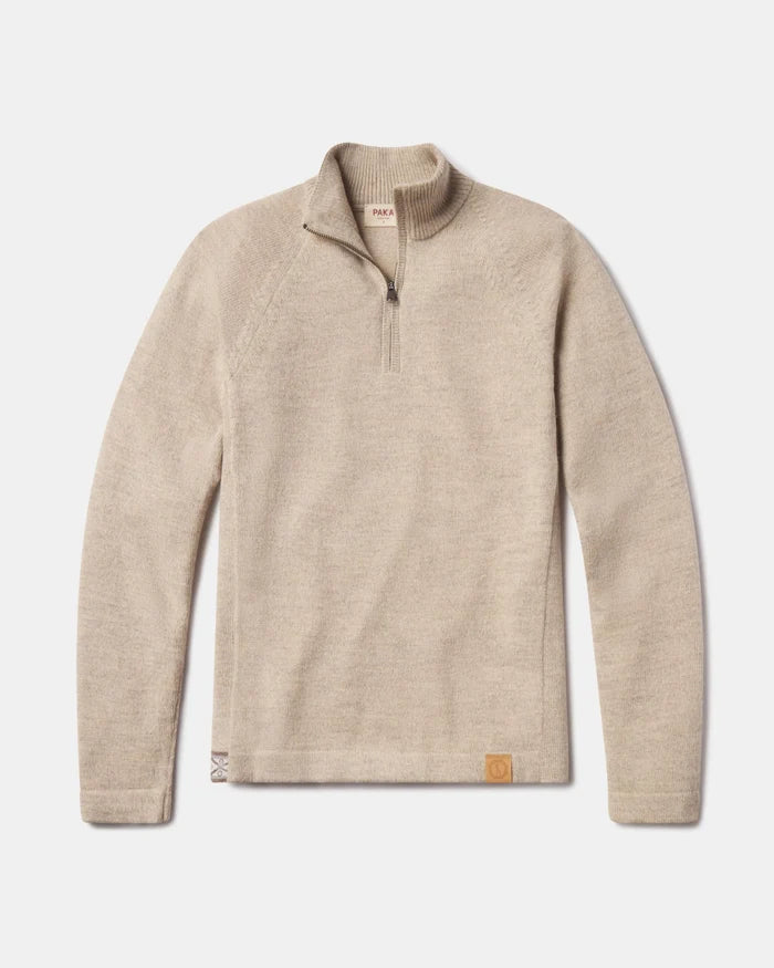 Flat lay of The Quarter Zip alpaca sweater showing quarter-zip collar, raglan sleeves, and leather logo patch on white background